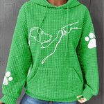 Women’s green pullover hoodie with hood and pouch pocket, dog graphic, paw-print sleeves