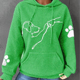 Women’s green pullover hoodie with hood and pouch pocket, dog graphic, paw-print sleeves