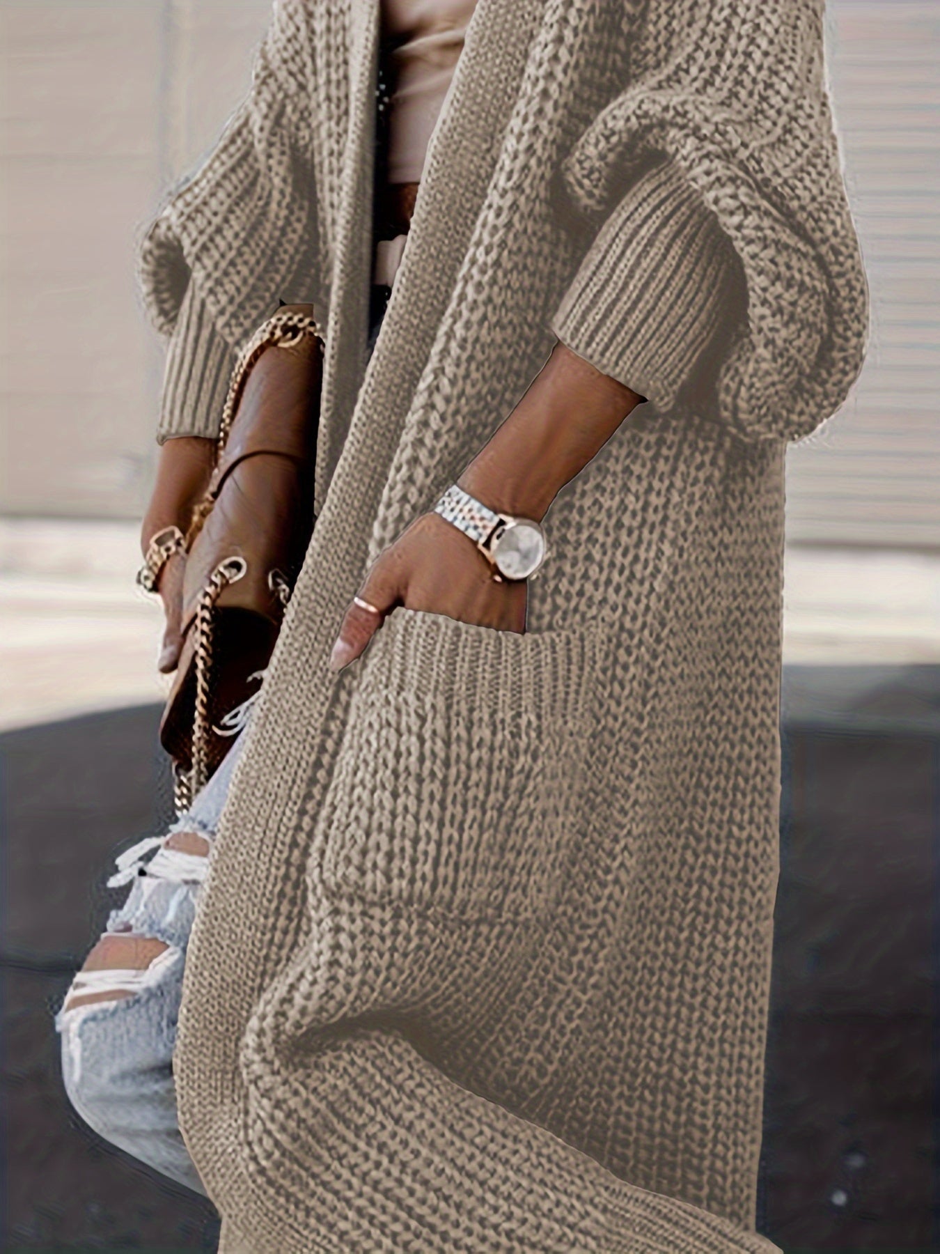 Beige long knit cardigan sleeve detail with open front and side pocket