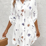 White floral button-front tunic dress with long sleeves and collar
