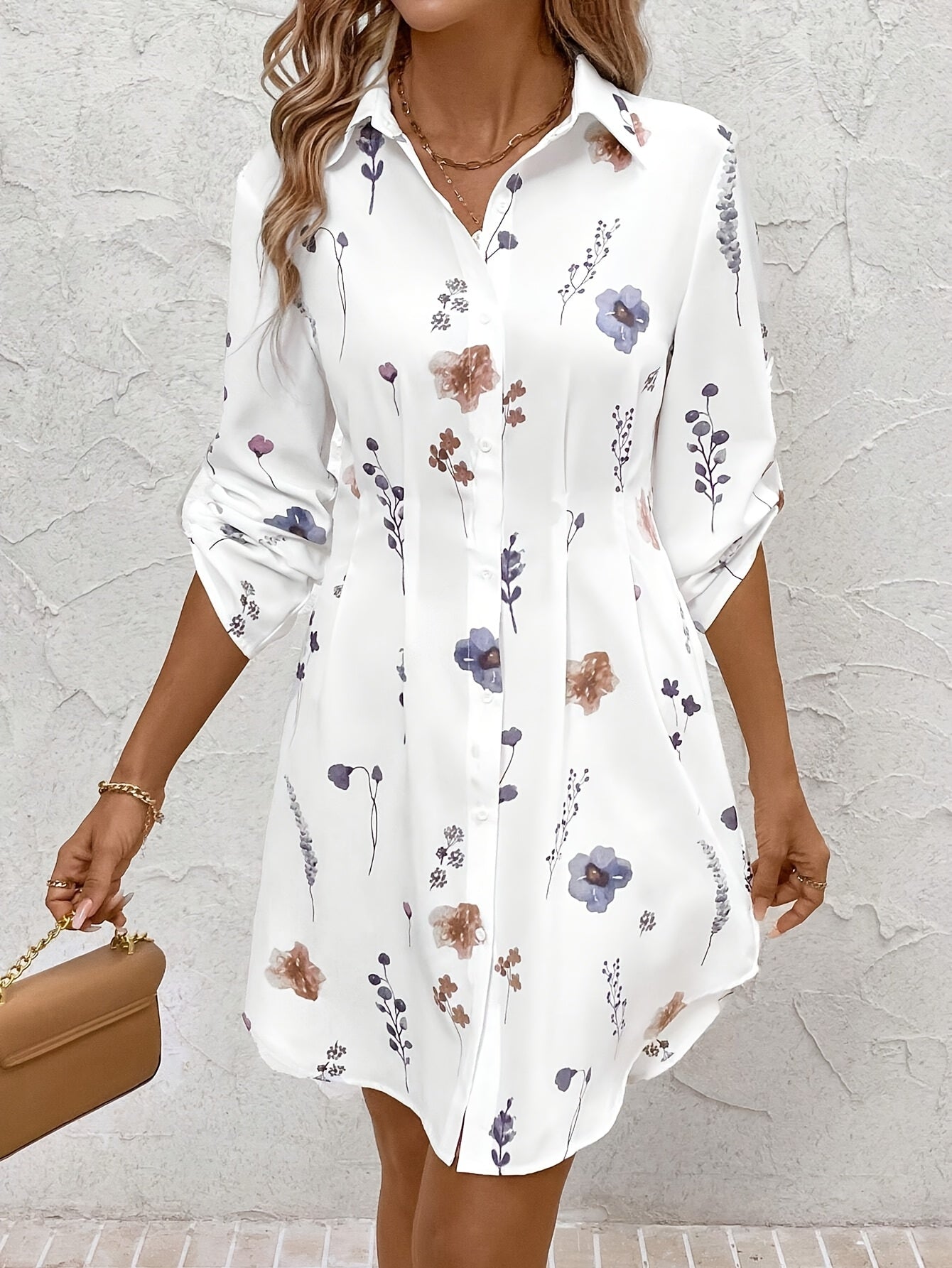 White floral button-front tunic dress with long sleeves and collar