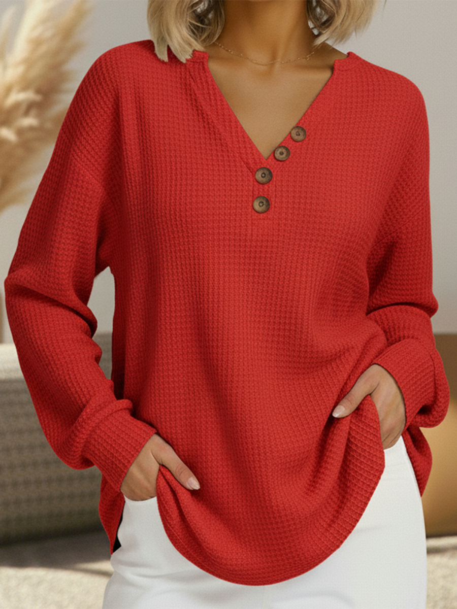 Women's red waffle-knit V-neck pullover with wood-look button placket
