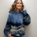 Blue hoodie with front kangaroo pocket, drawstring hood, forest landscape print