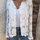 White lace cardigan with V-neck, gold buttons, long sleeves, open floral pattern