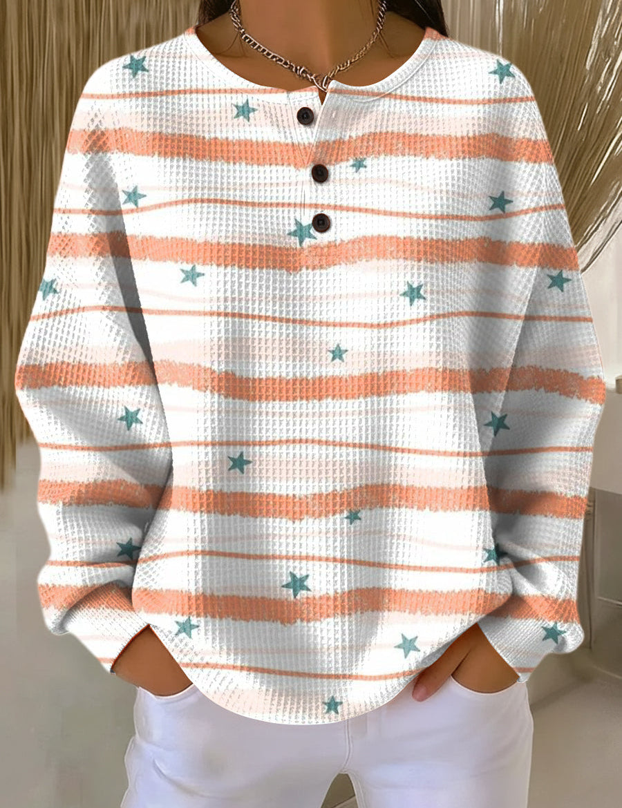 Women’s white and orange striped star pullover sweater with henley button placket