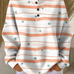 Women’s white and orange striped star pullover sweater with henley button placket