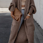 Taupe brown long knit cardigan with open front, long sleeves, and side pockets