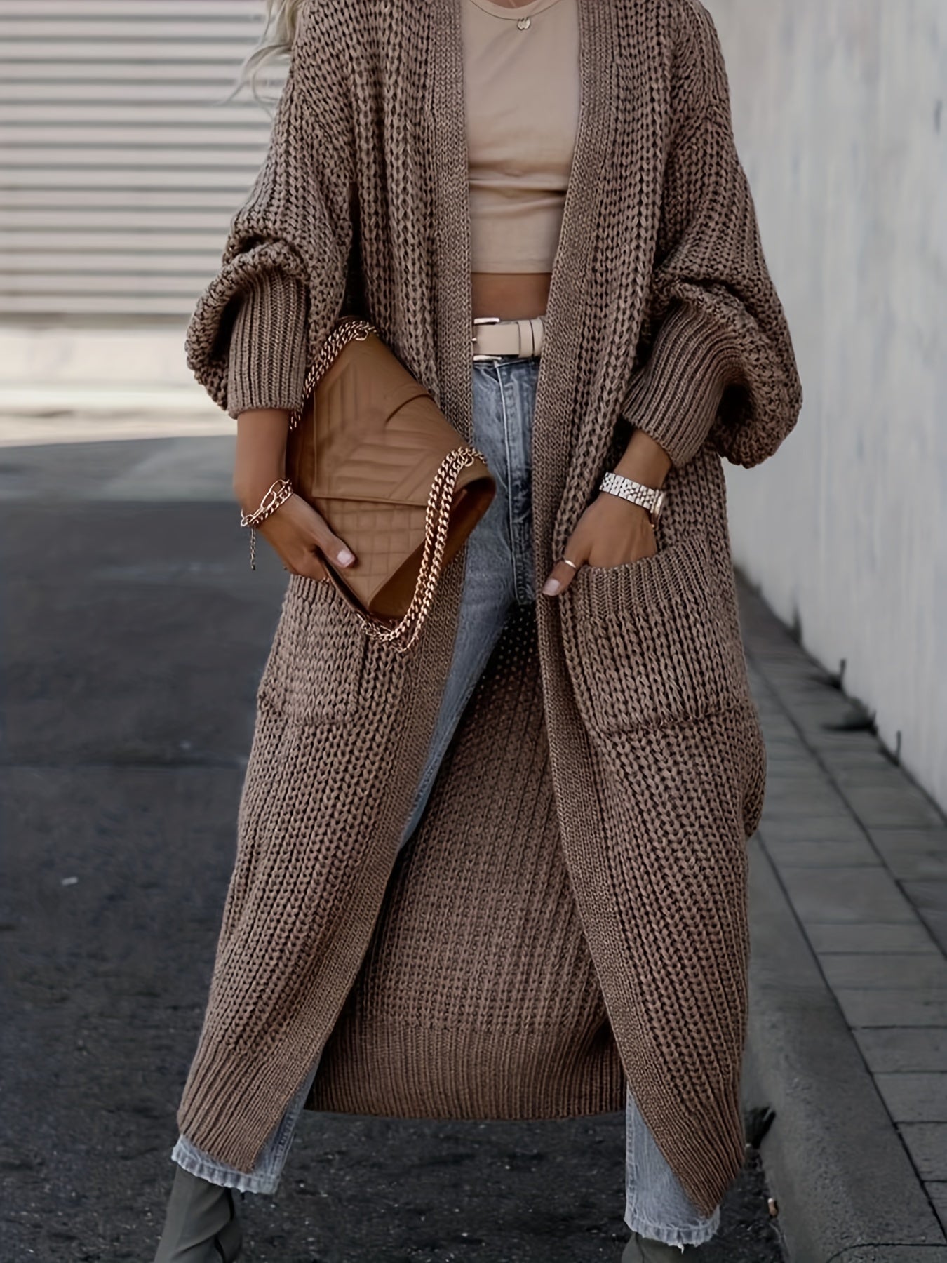 Taupe brown long knit cardigan with open front, long sleeves, and side pockets