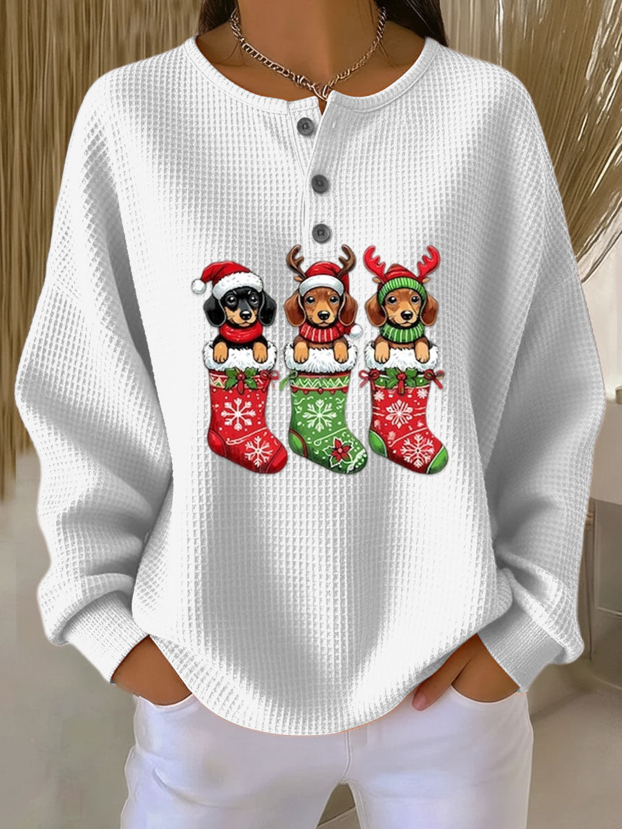White vintage Christmas henley sweater with dog motif and festive stockings graphic
