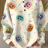 White knit pullover sweater with button front and colorful Halloween pumpkin graphics