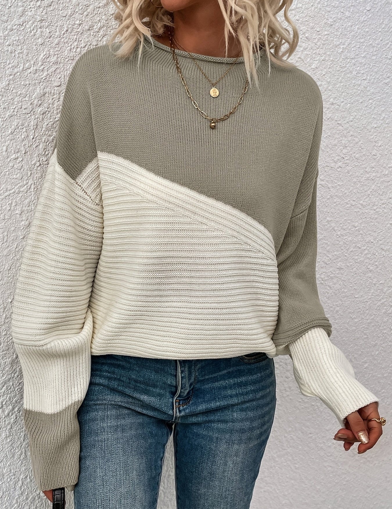 Olive green and white color-block pullover sweater with long sleeves and crew neck