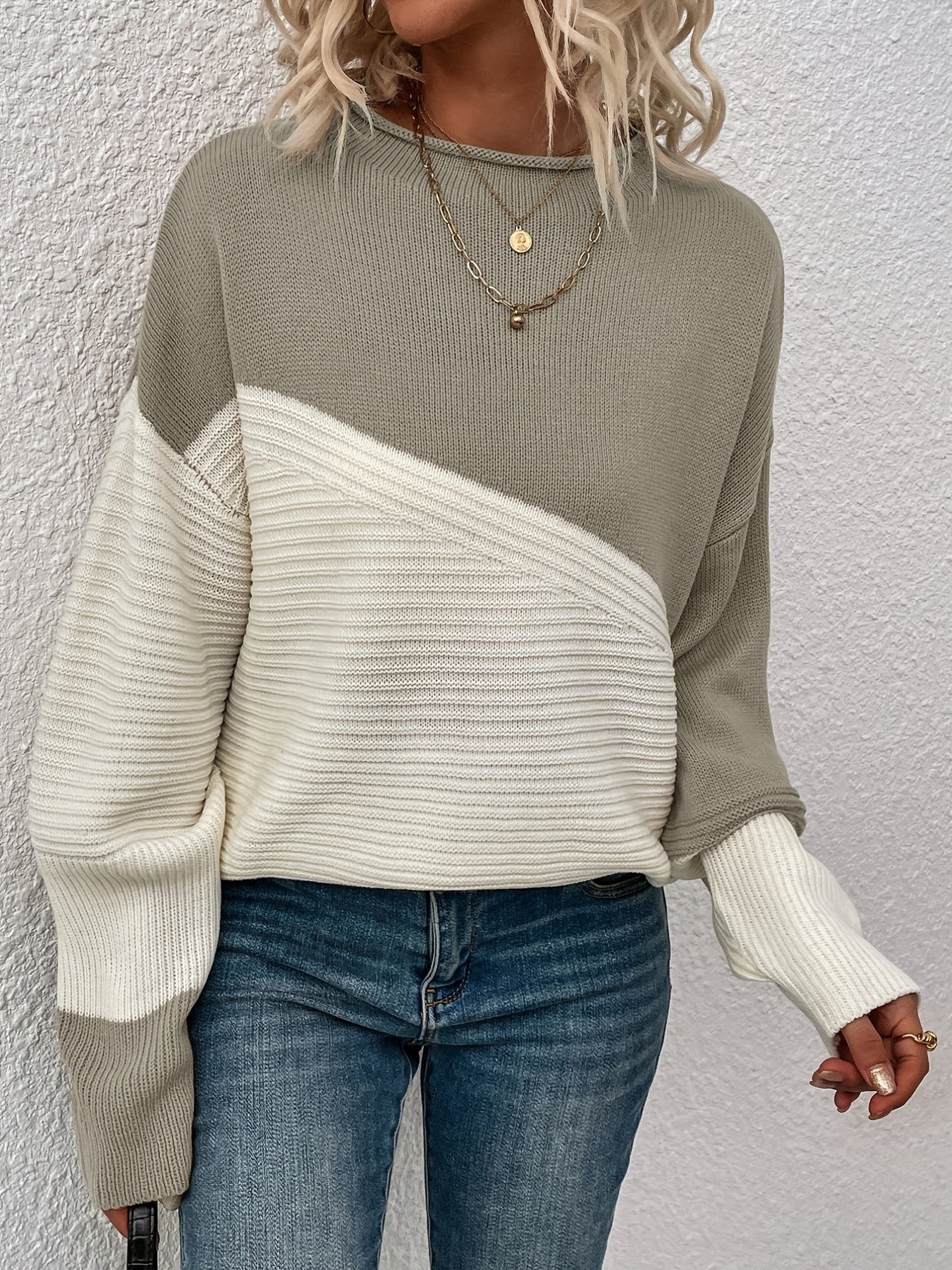Olive green and white color-block pullover sweater with long sleeves and crew neck