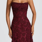Burgundy lace maxi dress with spaghetti straps and fitted ruched corset-style bodice
