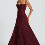 Burgundy lace maxi dress with spaghetti straps and flared tiered skirt hem
