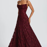 Burgundy lace maxi dress with spaghetti straps and flared tiered skirt hem