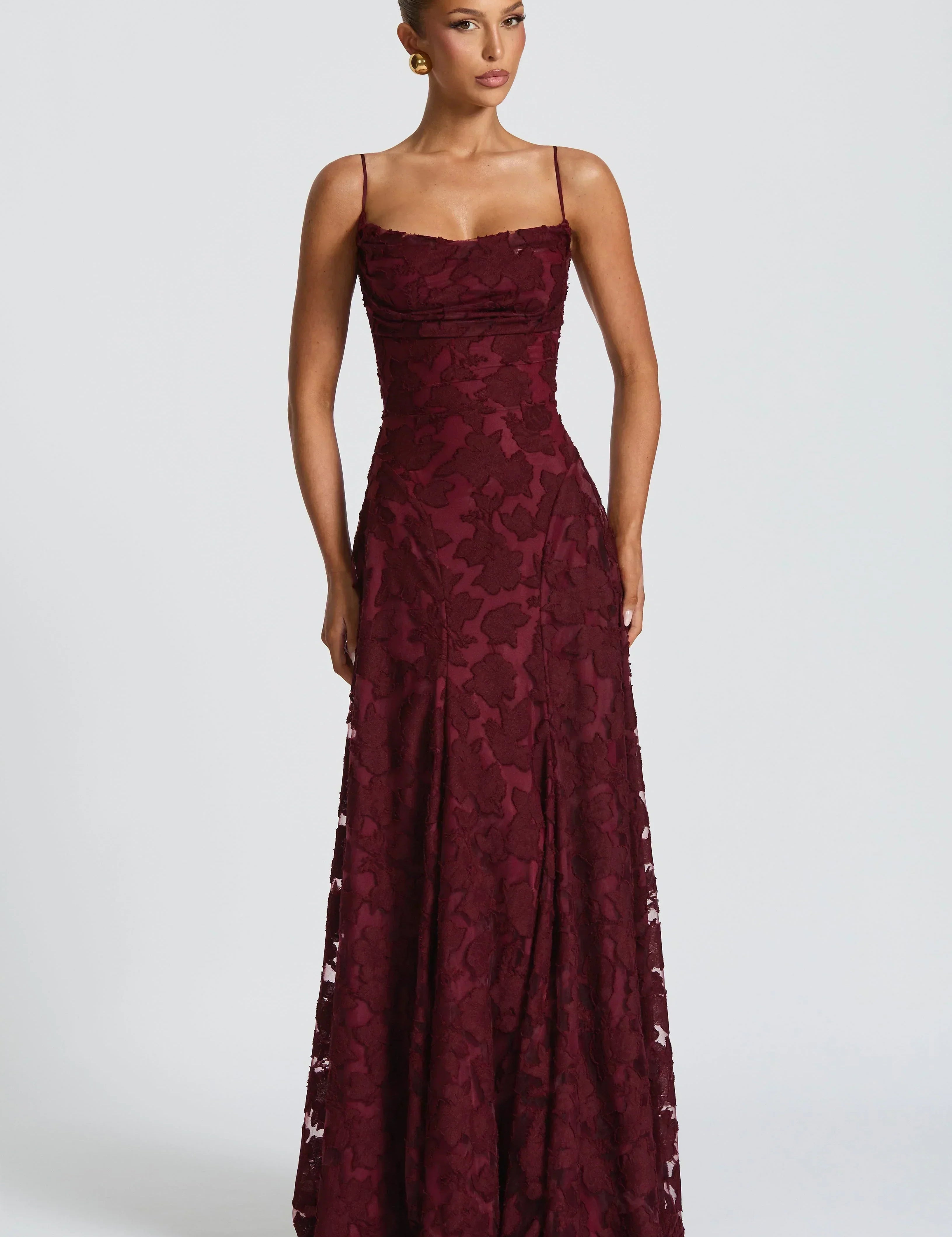 Burgundy lace maxi dress with spaghetti straps and sweetheart neckline, ruched bodice