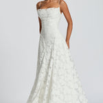 Ivory lace maxi dress with spaghetti straps and flowing flared skirt