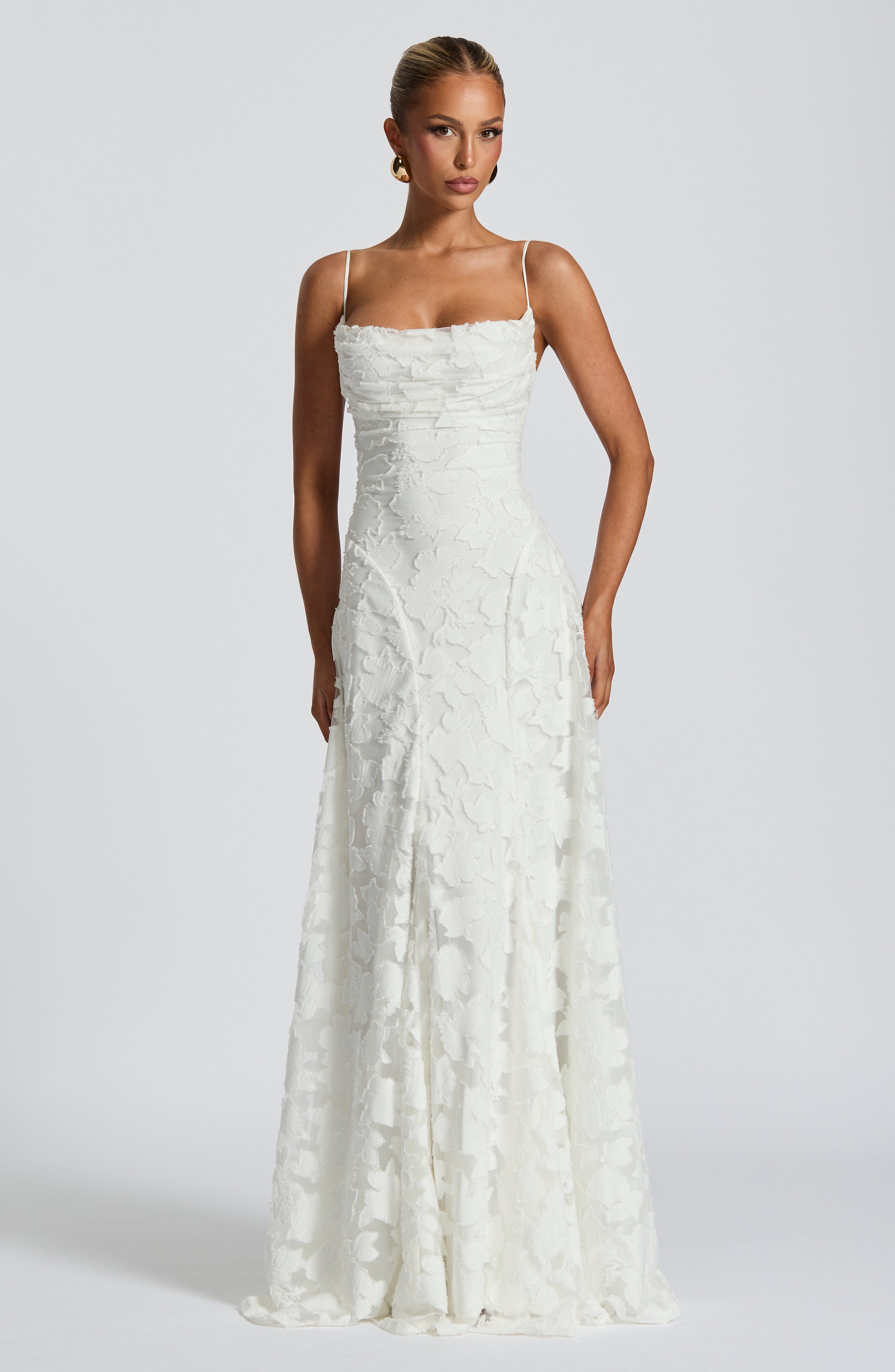 Ivory lace maxi dress with spaghetti straps and fitted corset bodice