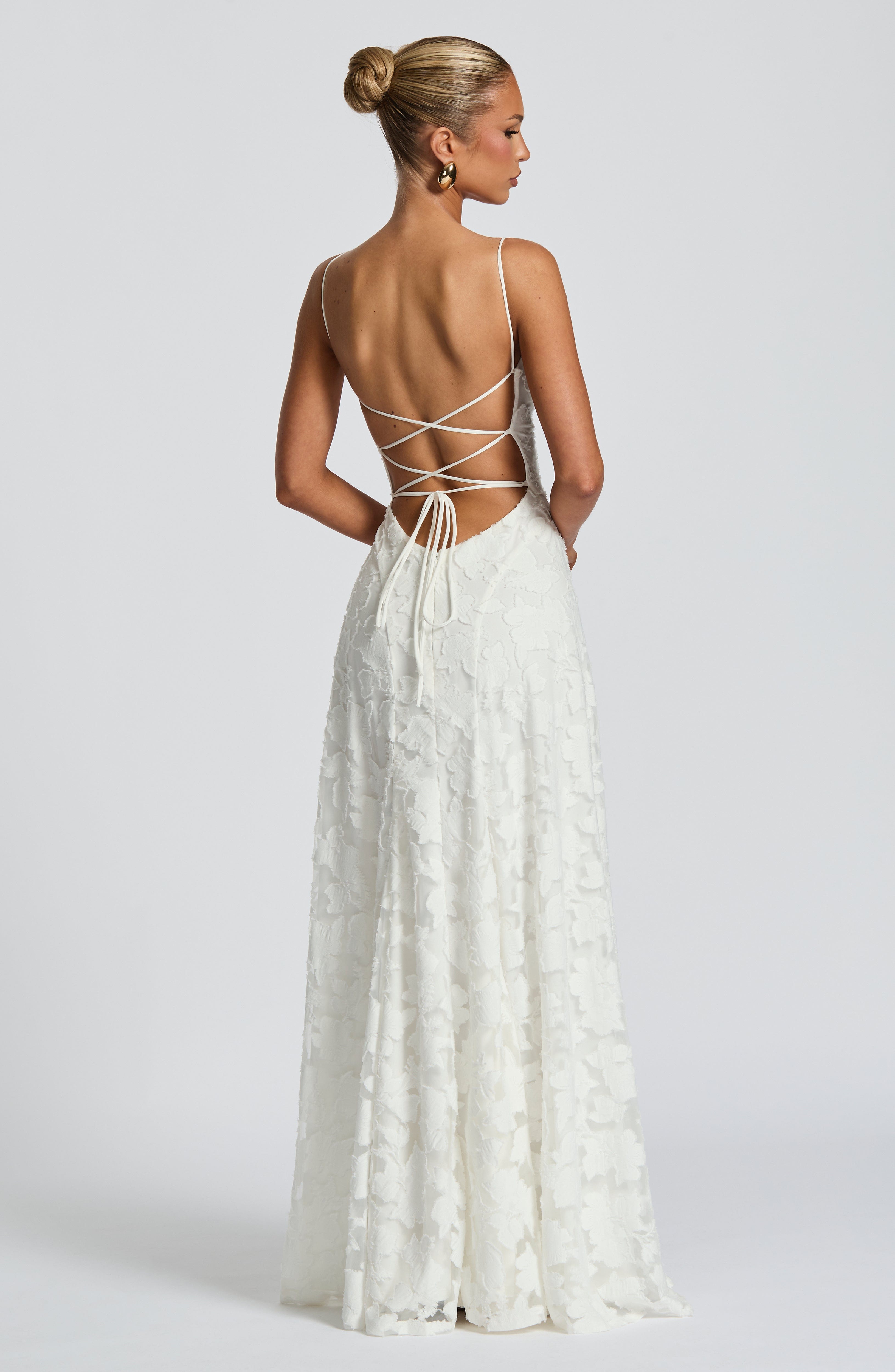 Backless ivory lace maxi dress with crisscross spaghetti straps at the back
