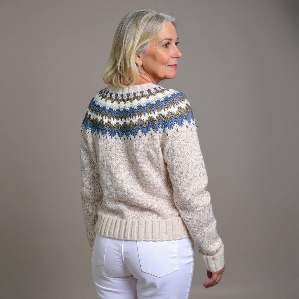 Cream chunky knit cardigan with blue striped yoke pattern, ribbed hem