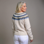 Cream chunky knit cardigan with blue striped yoke pattern, ribbed hem