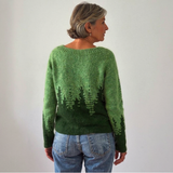 Green Icelandic-style sweater with crew neck and back tree-pattern intarsia