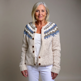 Cream knit cardigan with blue fair isle yoke, brown buttons, ribbed trim