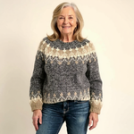Charcoal fair isle knit sweater with crew neck and cream snowflake-style pattern