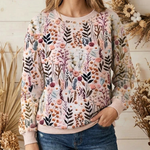 Women's botanical print pullover close-up, crew neck and long sleeves, pastel tones