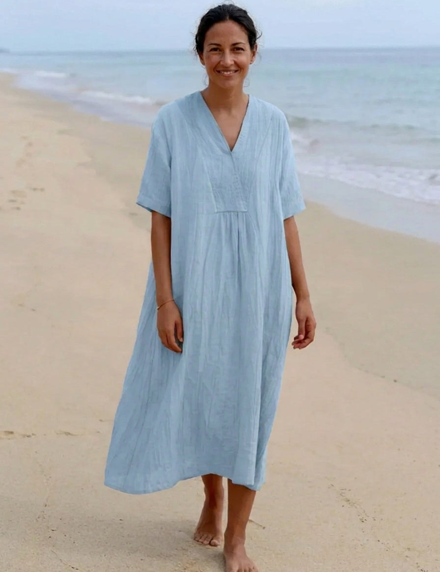 Light blue bohemian midi dress with V-neck, short sleeves, and gathered waist