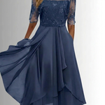 Navy lace dress with embroidered lace sleeves and layered ruffle midi skirt, flowing hem
