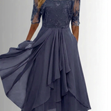 Navy lace dress with three-quarter sheer sleeves, floral bodice and ruffled tiered skirt
