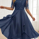 Navy lace dress with sheer three-quarter sleeves, fitted waist, layered ruffle midi skirt