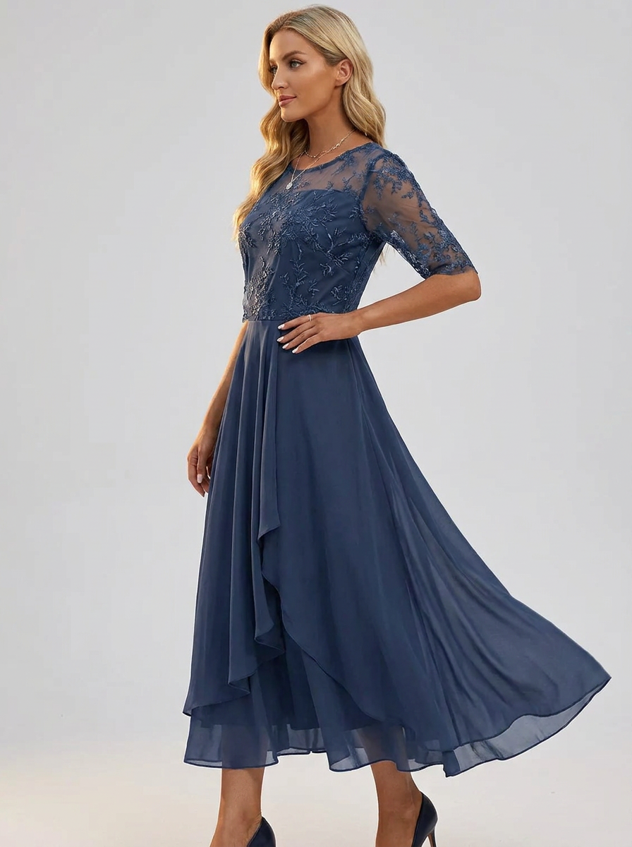 Navy lace dress with asymmetrical ruffled skirt detail and sheer three-quarter sleeves