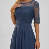Navy lace dress with sheer sleeves and floral embroidered bodice, tiered midi skirt