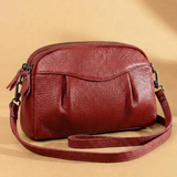 Finbjørg | Kleine und vielseitige Tasche in goldenem Cognac-Ton