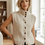Sleeveless beige cardigan with fuzzy knit, mock neck and front button placket