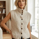 Sleeveless beige cardigan with fuzzy knit, mock neck and front button placket