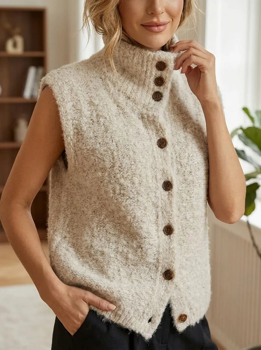 Sleeveless beige fuzzy cardigan with mock neck and long button-front opening
