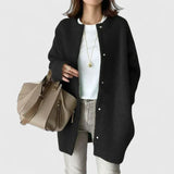 Black fuzzy button-front cardigan jacket with long sleeves and side pockets
