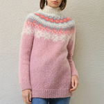 Light pink knit sweater with orange and white fair isle zigzag yoke