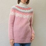 Light pink knit sweater with orange and white fair isle zigzag yoke