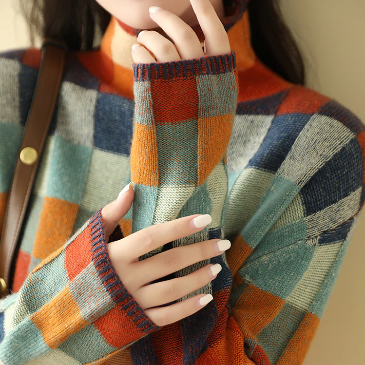 Plaid turtleneck sweater with multicolor checks and ribbed collar, close-up view