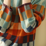 Ribbed sleeve cuffs and hem on multicolor plaid turtleneck sweater