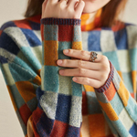 Plaid turtleneck sweater collar and sleeve cuffs in multicolor check knit