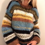 Striped knitted pullover with crew neck in brown, mustard, blue, and cream blocks