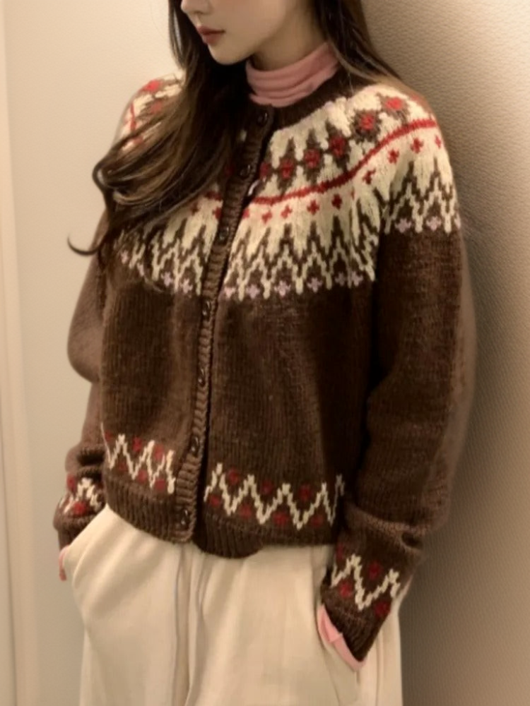 Brown fair isle knit cardigan with zip front, ribbed cuffs, and red zigzag yoke