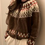Brown fair isle knit cardigan with zip front, ribbed cuffs, and red zigzag yoke