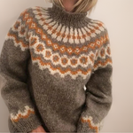 Cozy khaki fair isle turtleneck sweater with orange and cream patterns, long sleeves