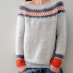 Handcrafted knit pullover in light gray with fair isle yoke and orange ribbed cuffs